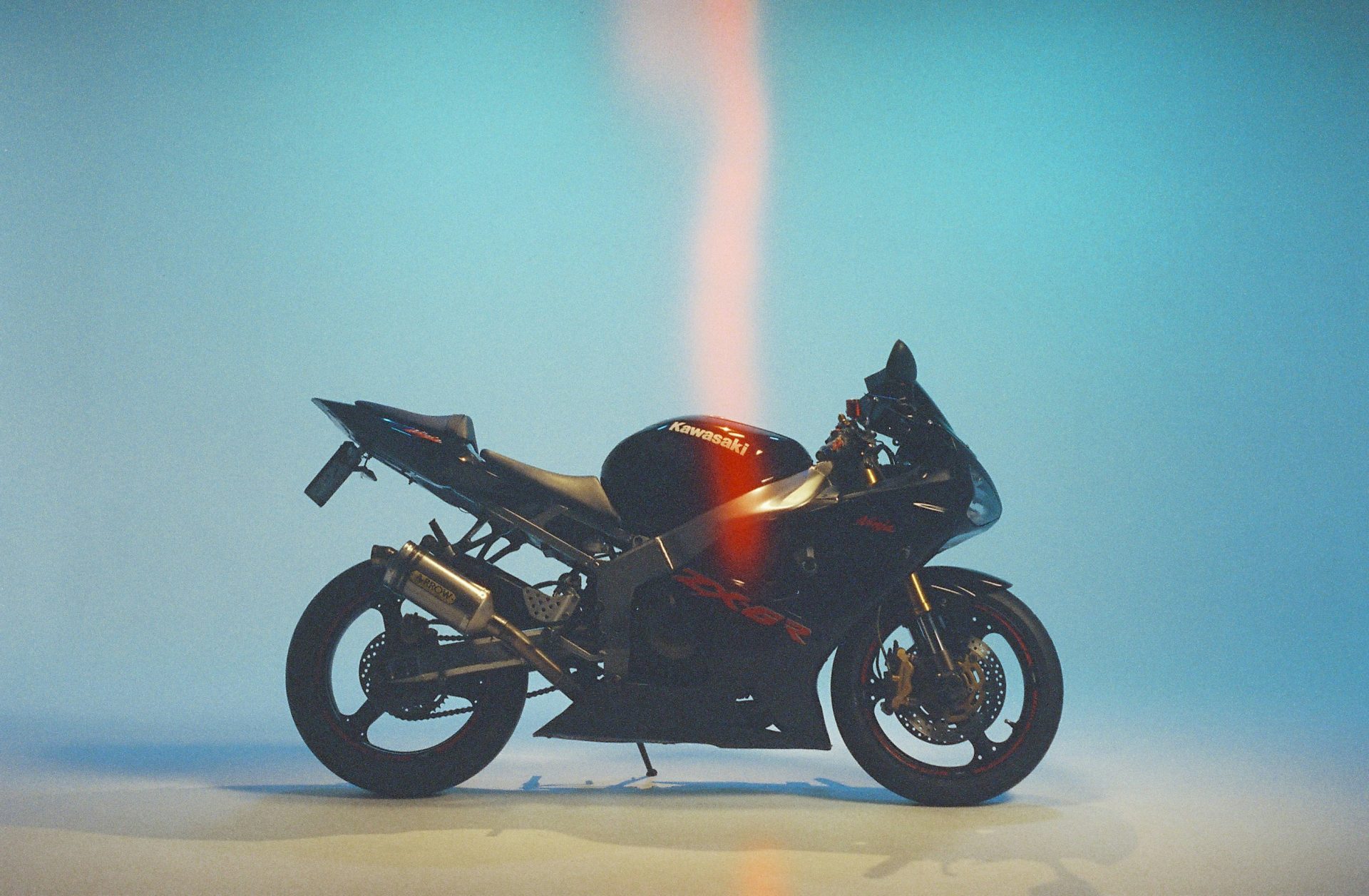 A black sport motorcycle with red accents.